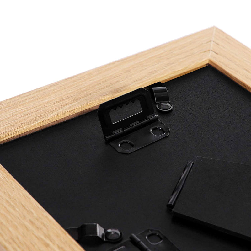 Close-up of the outer edge and mitred corner of the light wood grain picture frame