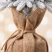 Close-up of the burlap-style fabric wrap on a tree base