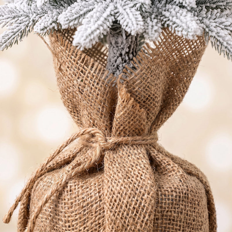 Close-up of the burlap-style fabric wrap on a tree base