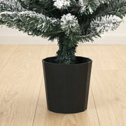 Close-up of the black plastic pot base and flocked branches