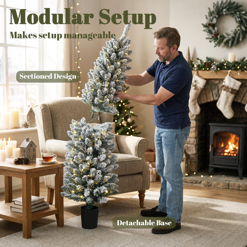 Man fitting the sectioned trunk of a flocked Christmas tree with detachable base