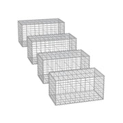 Studio shot of 4 empty galvanised steel gabion cages in a row