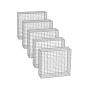 Studio shot of 5 empty galvanised steel gabion cages in a row