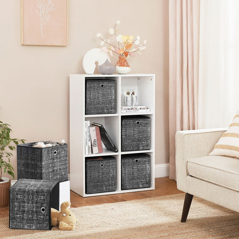 Fabric storage cubes fitted into a white cube shelving unit in a living room