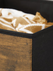 Close-up of the woven fabric corner and stitched black edging on a loaded cube