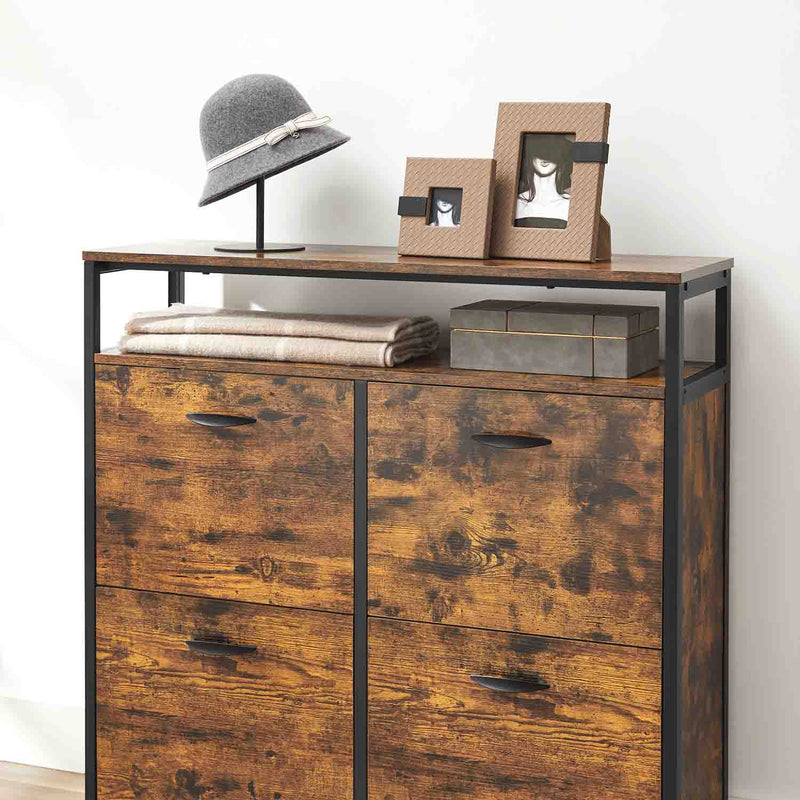Close up of the top shelf holding a hat, picture frames and folded towels