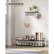 Songmics shoe shelf in a hallway entryway below a coat hook and bag