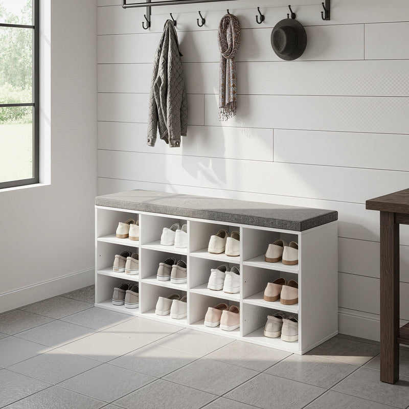 Person sitting on padded seat of shoe storage bench