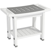 White shower stool with grey slatted seat pad and lower storage shelf on a plain background
