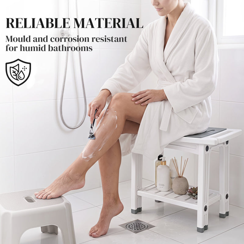 Woman in a robe sitting on the white shower stool shaving her leg, with mould and corrosion resistant callout