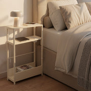 3-tier shelves on the Vasagle side table holding books and a remote