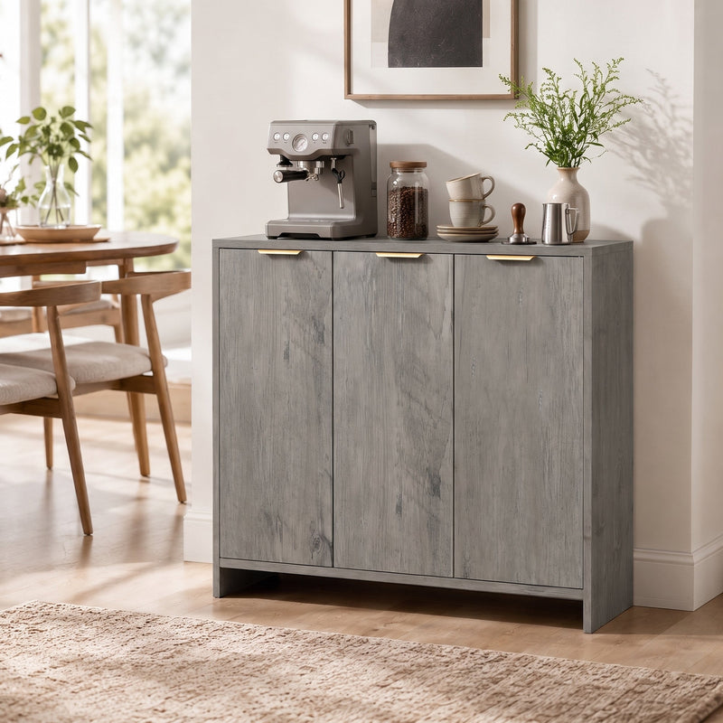 Grey sideboard used as a coffee station with an espresso machine and cups beside a dining table