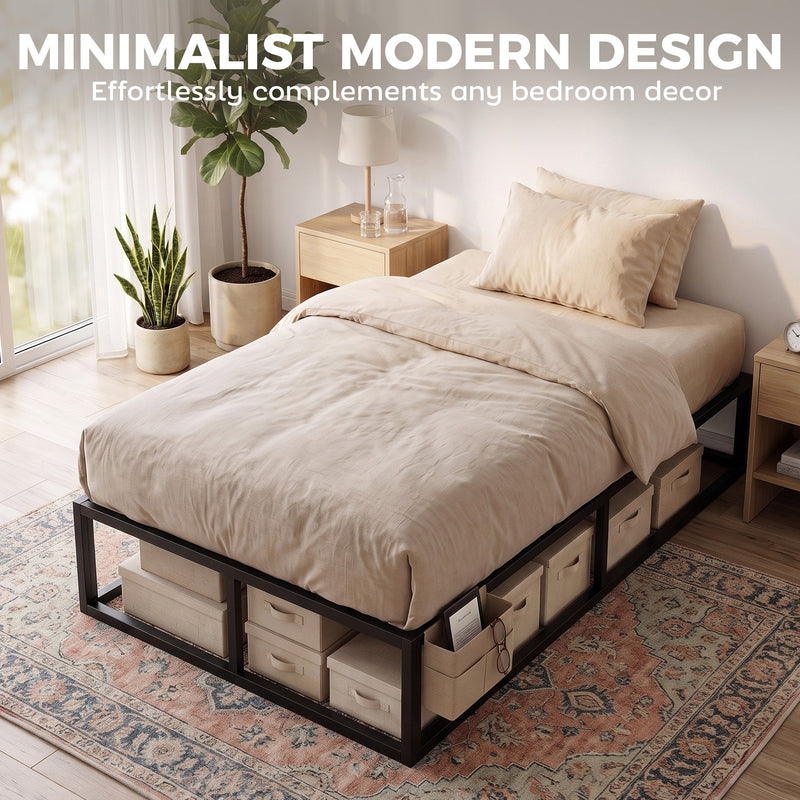 Bed frame styled with cream bedding and fabric storage boxes tucked underneath in a bright bedroom
