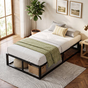 Single bed frame with a green throw and a wicker basket stored underneath beside a window