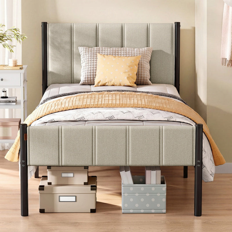 Cappuccino beige single bed frame with a winged upholstered headboard and footboard on black metal posts, storage boxes tucked underneath