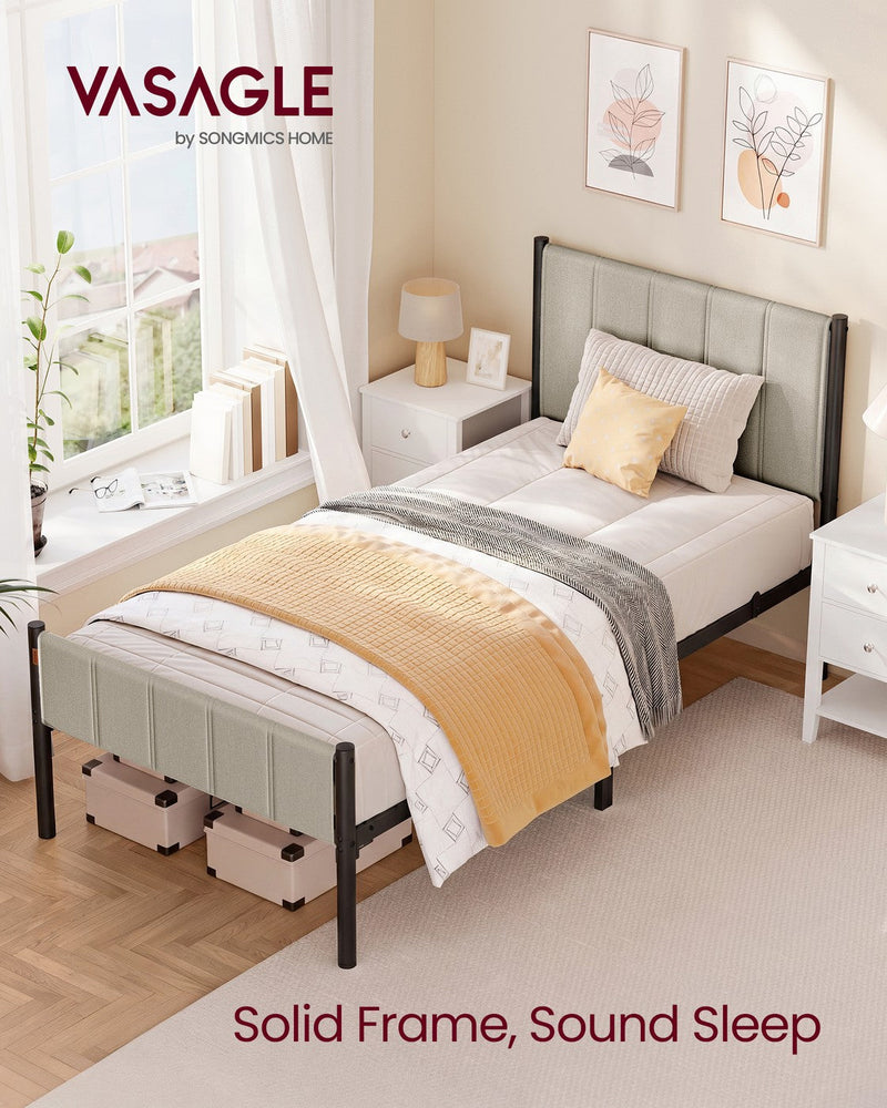 The single bed frame made up in a bright bedroom beside a window and bedside table, captioned solid frame, sound sleep
