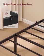 The bare black single frame and slats standing on a wooden floor, with an inset close-up of a sound isolator on the side rail