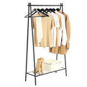 Black single rod garment rack holding shirts and a jacket with boots on the mesh shelf