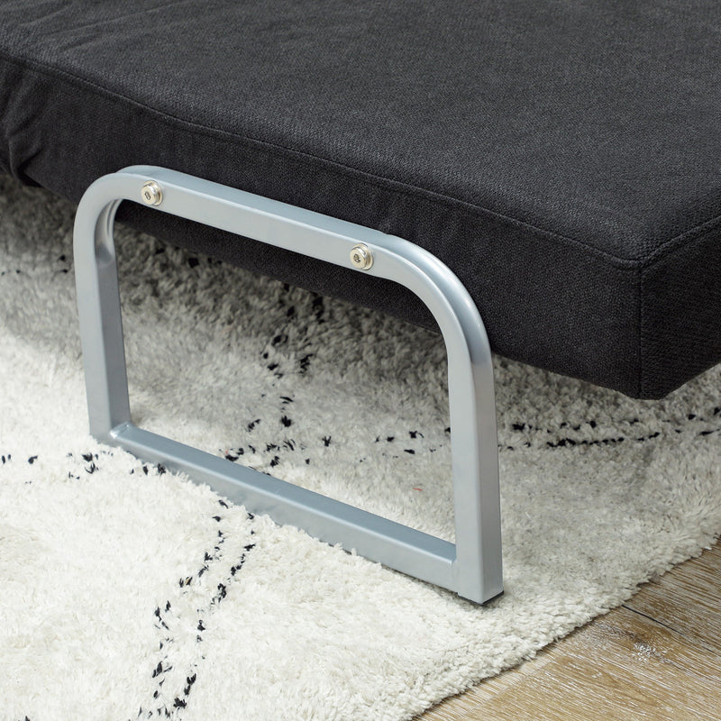 Chair bed in chaise lounge position in a living room with side table