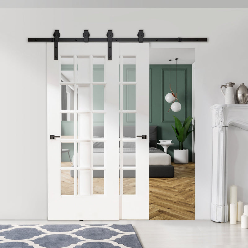 Sliding barn door hardware carrying two white glazed doors into a bedroom