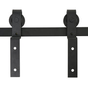 Close-up of two industrial wheel rollers and hanger straps mounted on the black rail