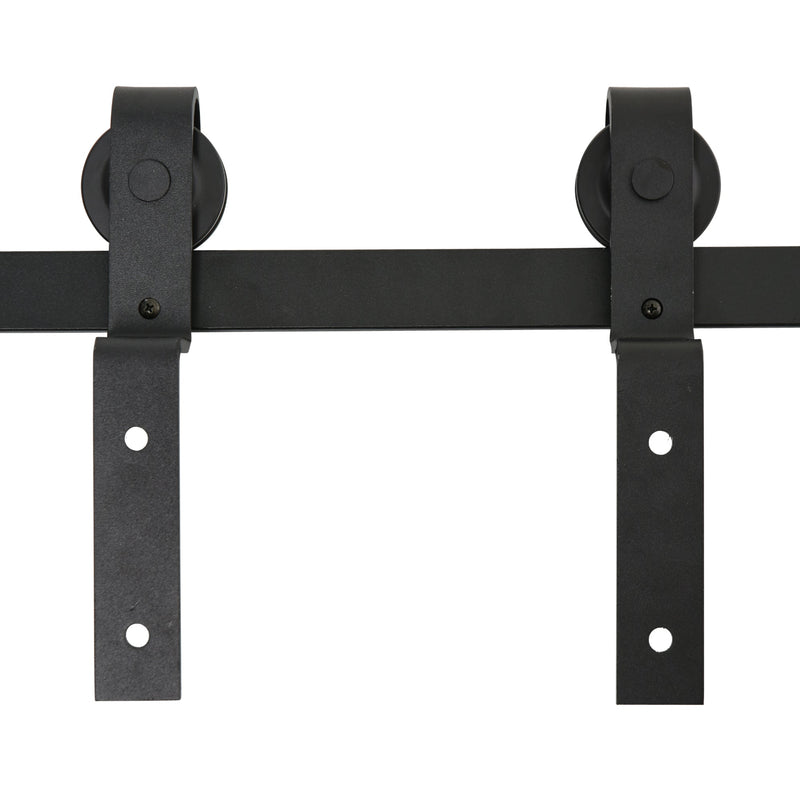 Close-up of two industrial wheel rollers and hanger straps mounted on the black rail