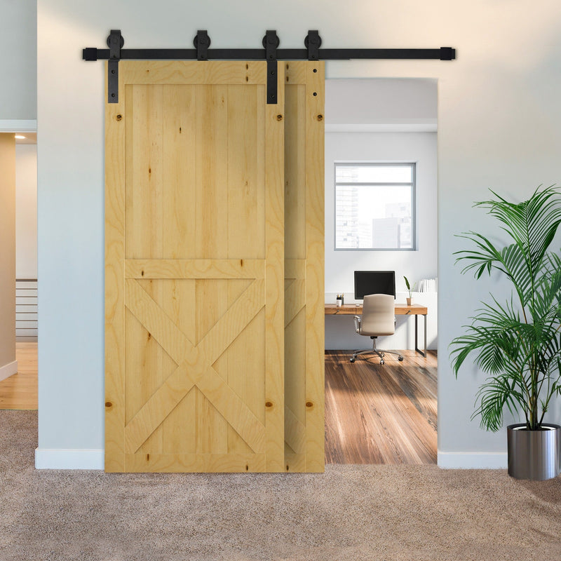 Wooden barn doors on the black track sliding open to reveal a home office