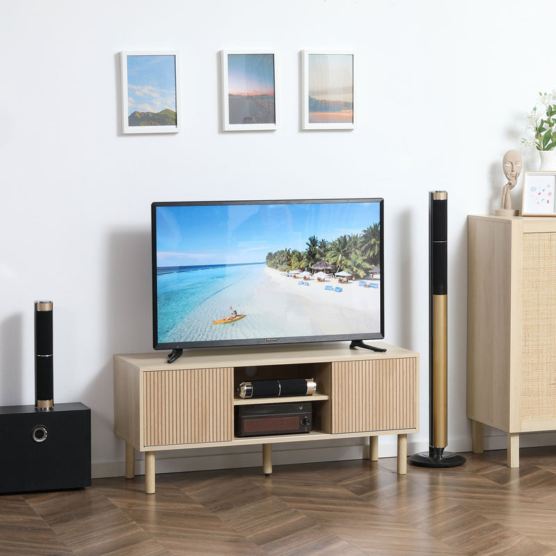 Lifestyle photo of the oak TV cabinet stand in a living room with a TV and soundbar on top