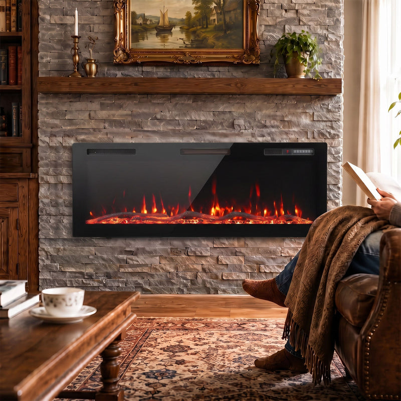 Slim electric fire mounted below a stone fireplace surround in a living room