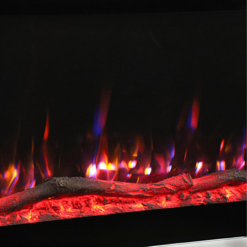 Close-up of orange and purple flames above a glowing ember bed