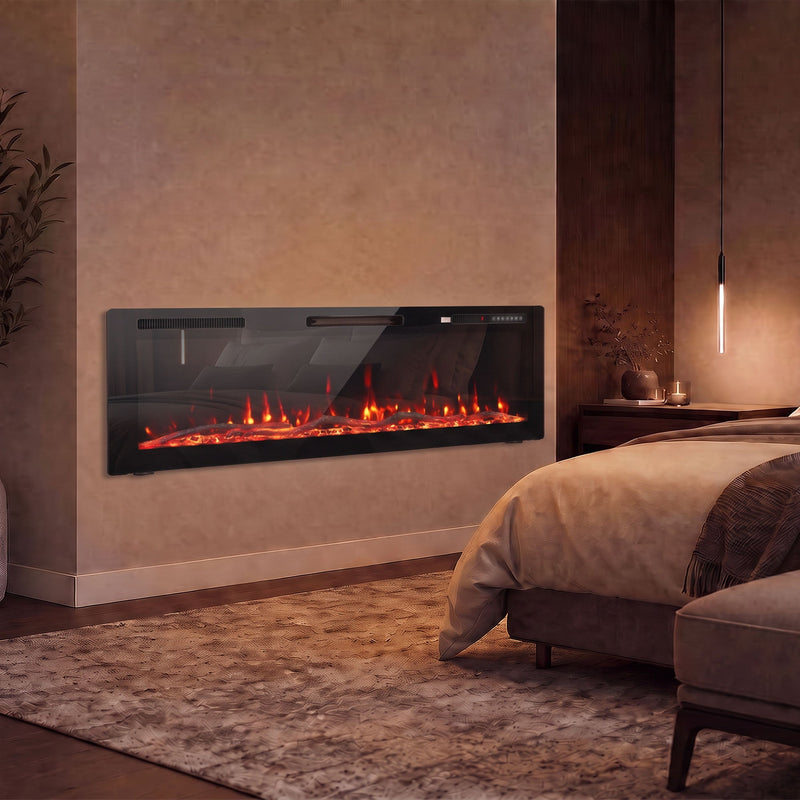 Slim electric fire on a bedroom wall beside a bed