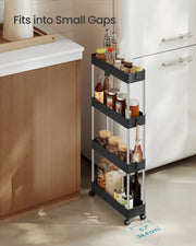 Black storage trolley fitted into a narrow kitchen gap beside a fridge, holding jars and bottles