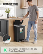 Man dropping rubbish into a black 50L kitchen bin, with a close-up of the folded-down foot pedal
