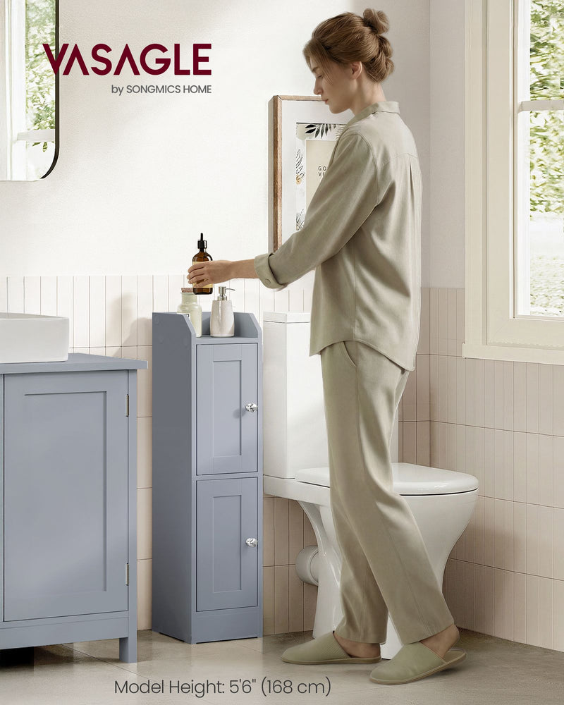 Woman reaching for a bottle on the slim cabinet beside a toilet and vanity