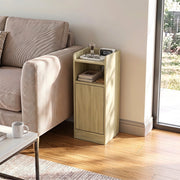 Oak slim table beside a sofa with a clock and glasses on the top tray
