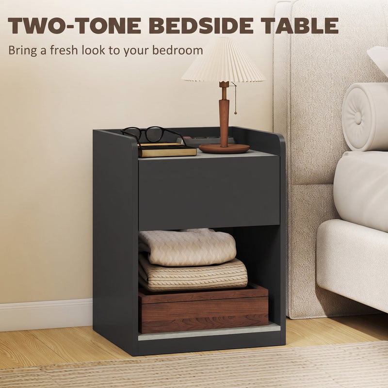 Two-tone bedside table styled with a table lamp, glasses and books in a bedroom setting