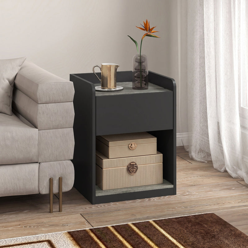 Bedside table in a living room setting with a jug, vase and flowers on top
