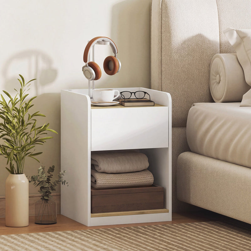 White and oak bedside table styled with coffee, glasses and headphones on the tabletop