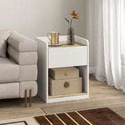 White and oak bedside table used as a side table next to a sofa with storage boxes on the shelf