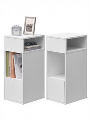 Two bedside tables, one styled with a clock, photo frame, glasses and books