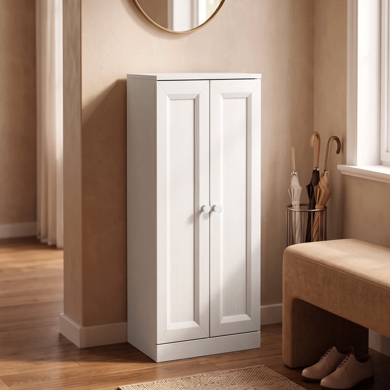 White bathroom cabinet in an entryway beside an umbrella stand and bench