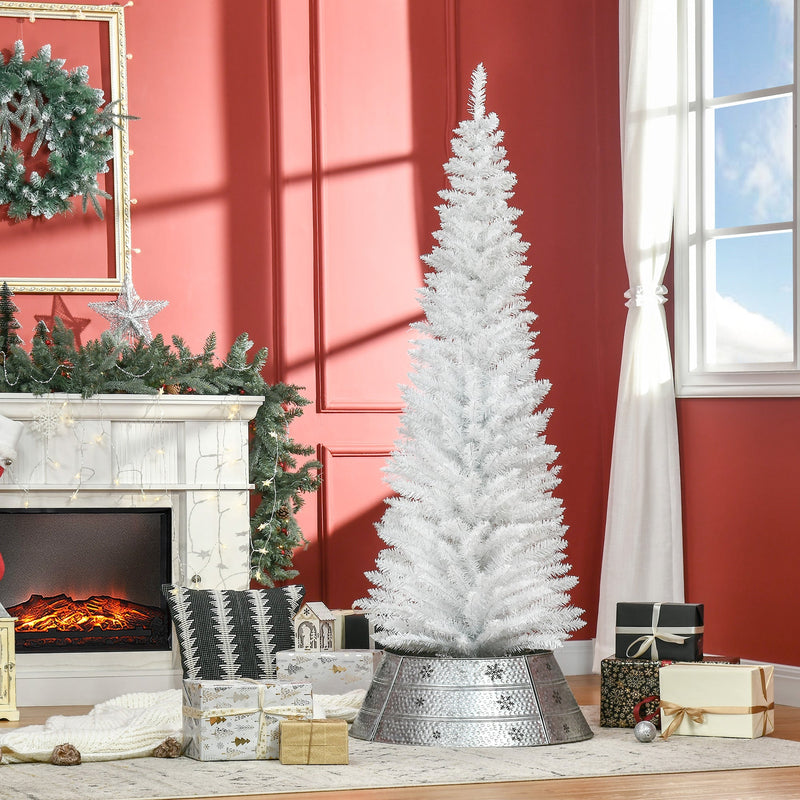 White pencil Christmas tree beside a fireplace in a red-walled living room with gifts