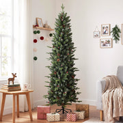 Slim pine Christmas tree in a bright room next to a wooden side table