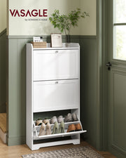 White shoe cabinet against a green hallway wall with the bottom drawer open