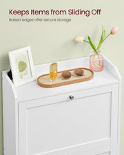 Raised-edge top shelf of the white shoe cabinet holding a photo frame, tray and vase