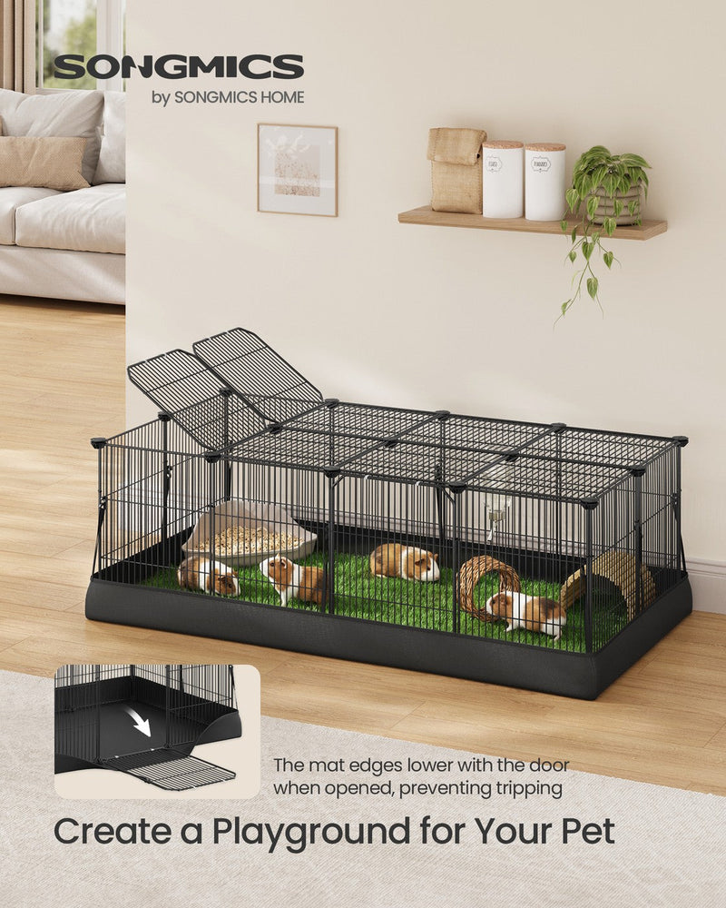 Lifestyle shot of guinea pigs on turf bedding inside the playpen set up on a wood floor with the top lid propped open.