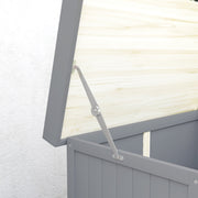 Close-up of the metal support stay holding the hinged lid of the grey wooden shed open