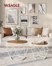 Coffee table set styled in a living room next to a sofa with a vase of flowers