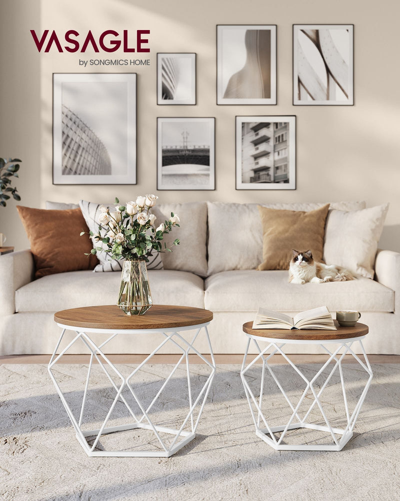 Coffee table set styled in a living room next to a sofa with a vase of flowers