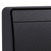 Close-up of the black heater's textured front grille and housing corner